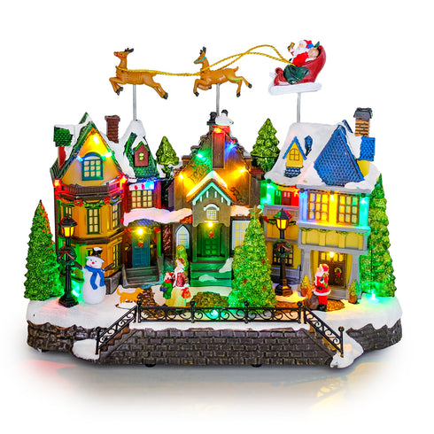 Animated Christmas Village with Flying Santas leigh with reindeer and Rotating Tree