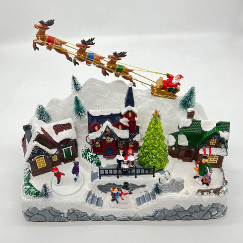 Christmas Snowy Hillside Village with Reindeer and Animated Musical Winter Scene